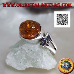 Silver ring with oval cabochon amber crosswise with elongated triangular hole