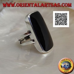 Silver ring with large rectangular beveled onyx on smooth frame with lateral opening
