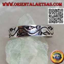 Silver ring with stylized fish separated by a curved line