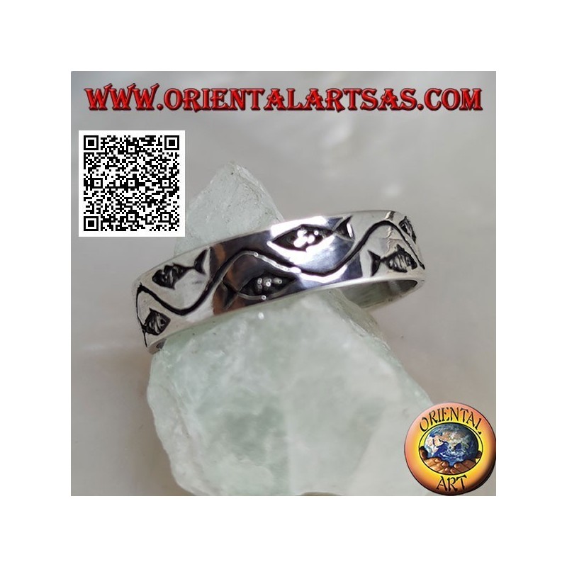 Silver ring with stylized fish separated by a curved line