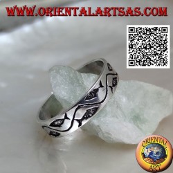 Silver ring with stylized fish separated by a curved line
