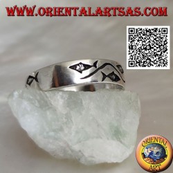 Silver ring with stylized fish separated by a curved line