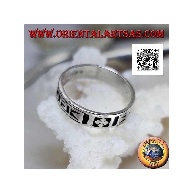 Silver ring with a geometric motif between stylized dorje engraved twice