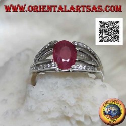Silver ring with natural oval ruby set with two lines of zircons and two of silver