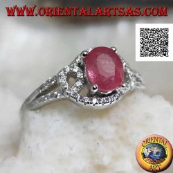 Silver ring with natural oval ruby set on intertwined lines of white zircons