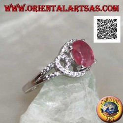 Silver ring with natural oval ruby set on intertwined lines of white zircons