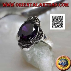 Silver ring with oval amethyst set between four semicircles studded with marcasite