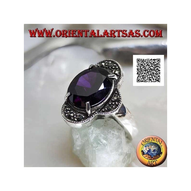 Silver ring with oval amethyst set between four semicircles studded with marcasite