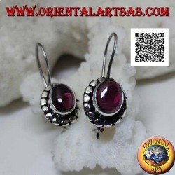 Silver earrings with oval cabochon natural garnet surrounded by disks with silver studs