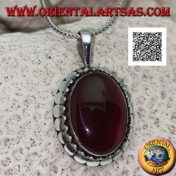 Silver pendant with large oval cabochon carnelian surrounded by trio of balls and studs
