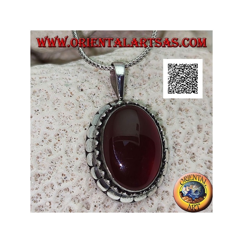 Silver pendant with large oval cabochon carnelian surrounded by trio of balls and studs