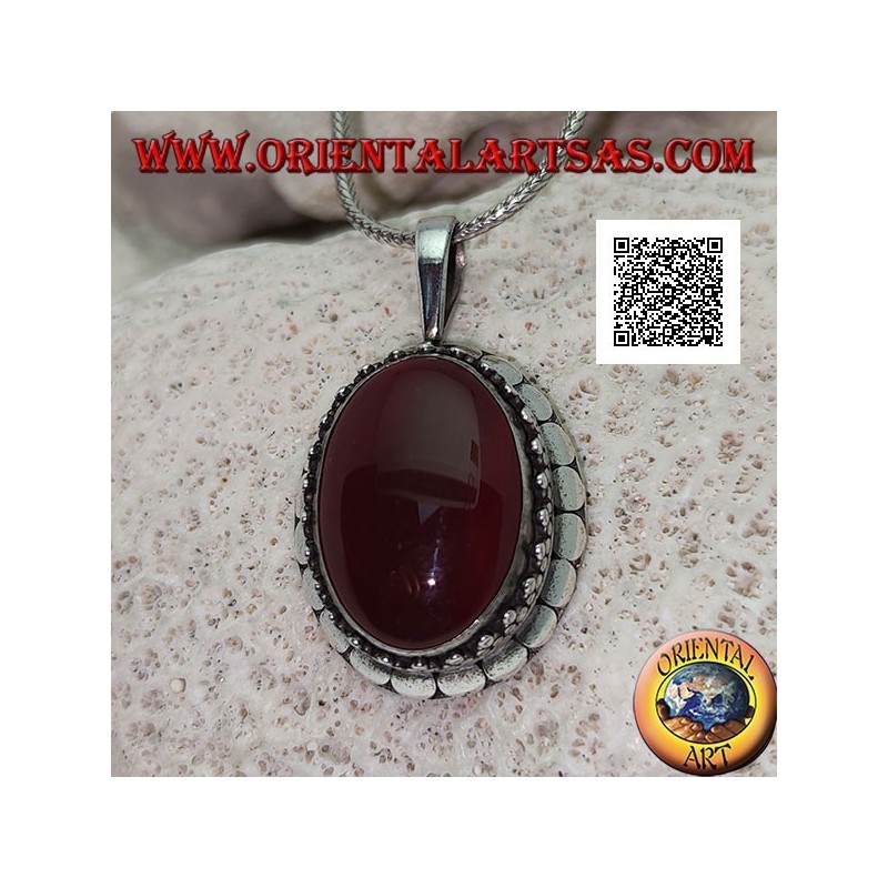 Silver pendant with large oval cabochon carnelian surrounded by trio of balls and studs