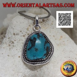 Silver pendant with ancient Tibetan turquoise of irregular shape surrounded by weaving