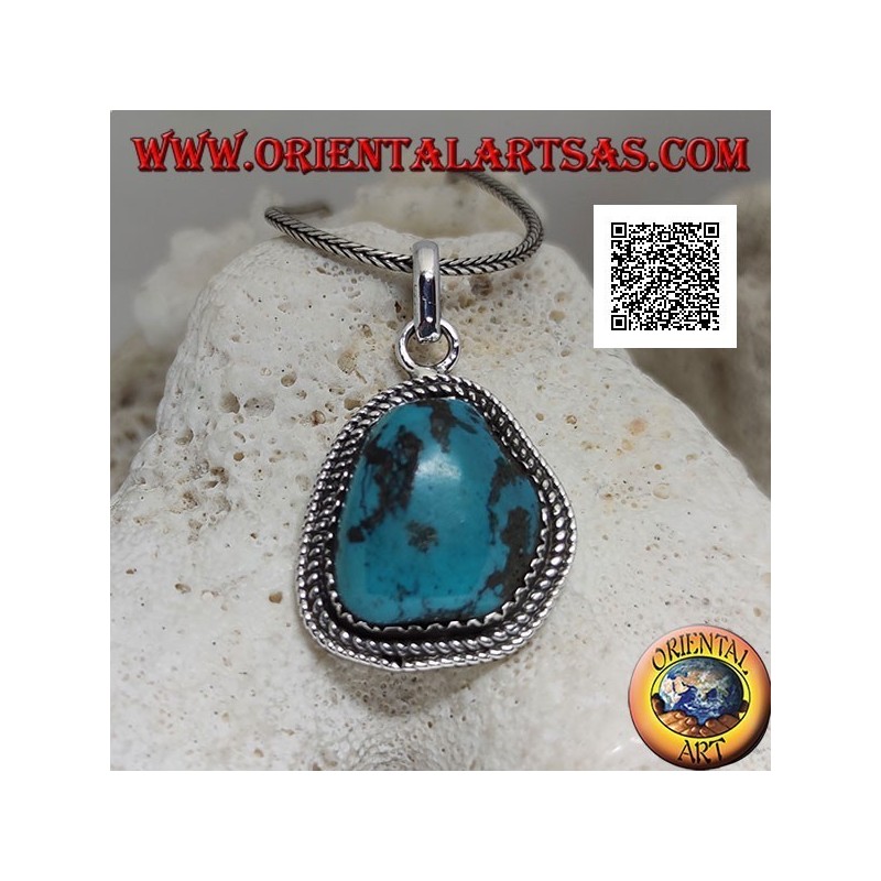 Colgante de plata con turquesa tibetana antigua de forma irregular rodeada de tejido