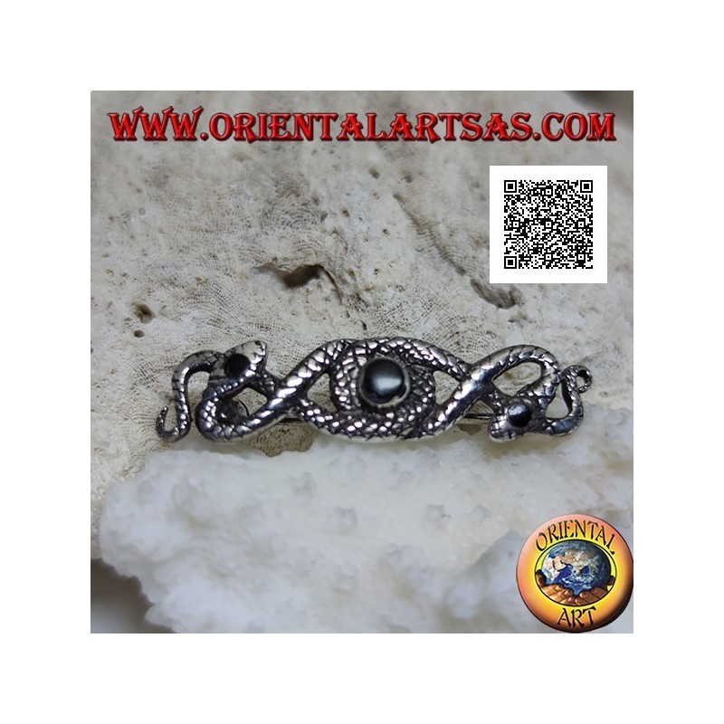 Silver brooch in the shape of two snakes intertwined with central onyx and on the eyes
