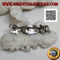 Silver brooch in the shape of two snakes intertwined with central onyx and on the eyes