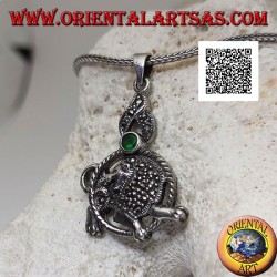 Silver pendant in the shape of a lion in the circle with mane and mantle studded with marcasite and green zircon above