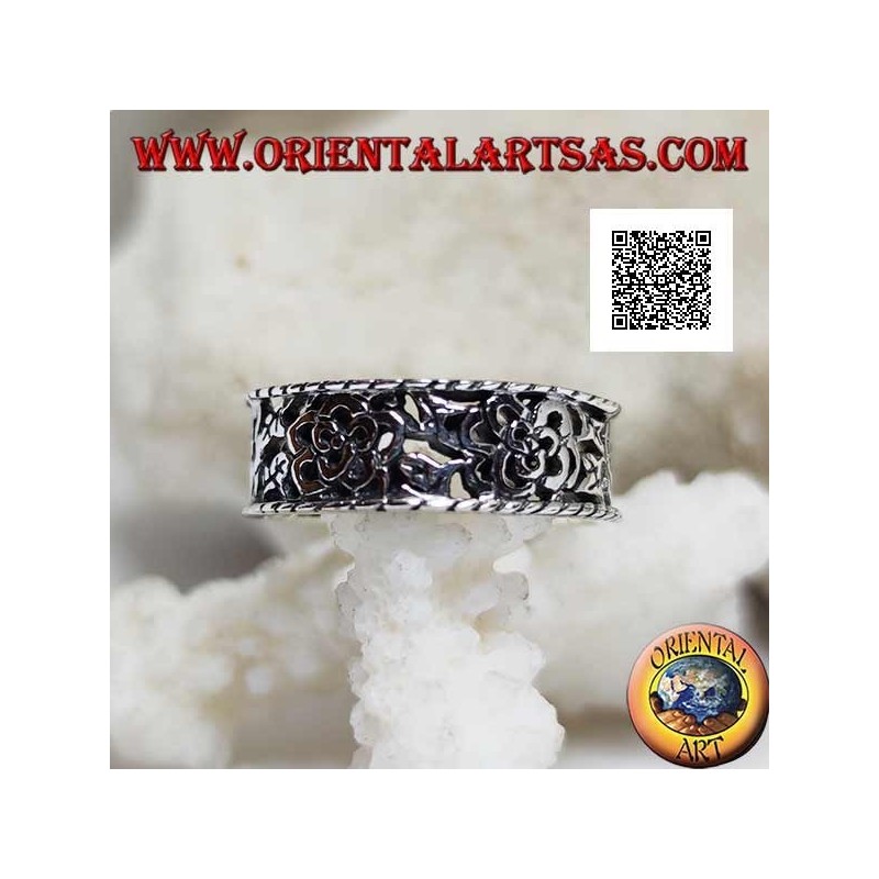 Silver ring with a dense openwork floral pattern and protruding edges