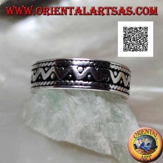 Silver ring with broken line and disc discs on an oxidized background