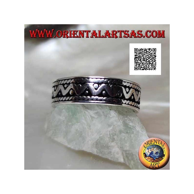 Silver ring with broken line and disc discs on an oxidized background