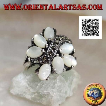 Silver ring with seven oval mother-of-pearl set separated by a curved line of marcasite