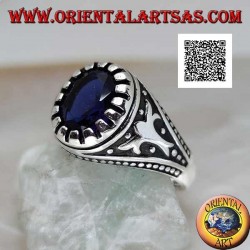 Silver ring with faceted oval synthetic sapphire with imperial motif engraved on the sides