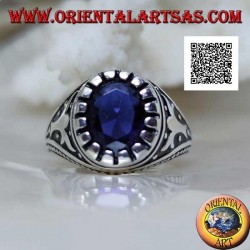 Silver ring with faceted oval synthetic sapphire with imperial motif engraved on the sides