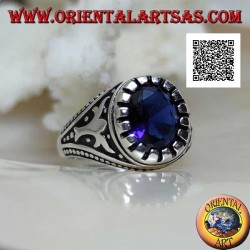 Silver ring with faceted oval synthetic sapphire with imperial motif engraved on the sides