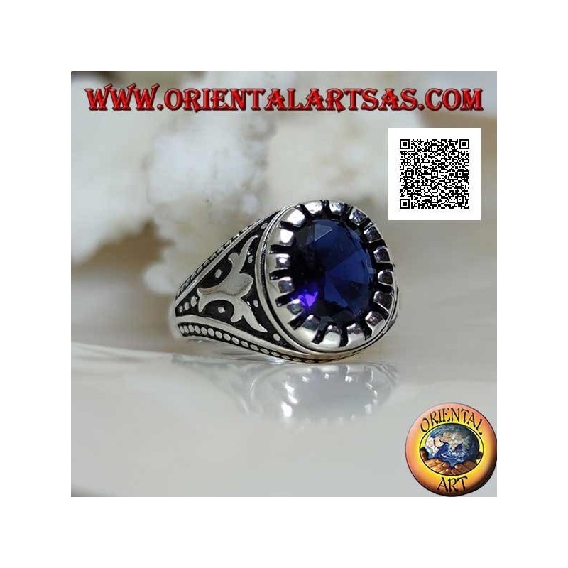 Silver ring with faceted oval synthetic sapphire with imperial motif engraved on the sides