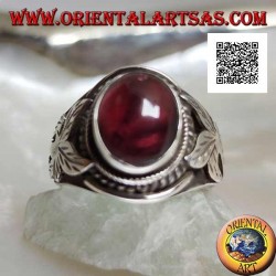 Silver ring with oval cabochon natural garnet and flower on the sides