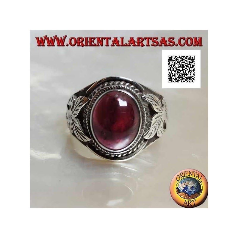 Silver ring with oval cabochon natural garnet and flower on the sides