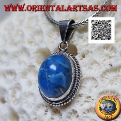 Silver pendant with oval cabochon turquoise surrounded by a double two-dimensional weave