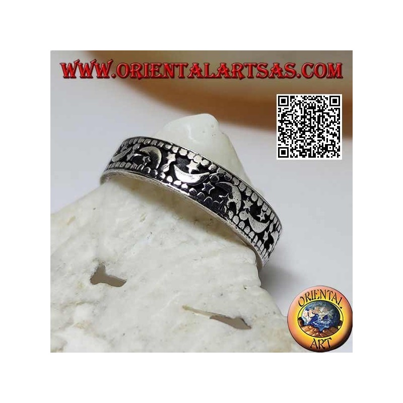 Bague en argent avec lunes et étoiles sur fond creux