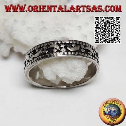 Silver ring with moons and stars on a hollowed background