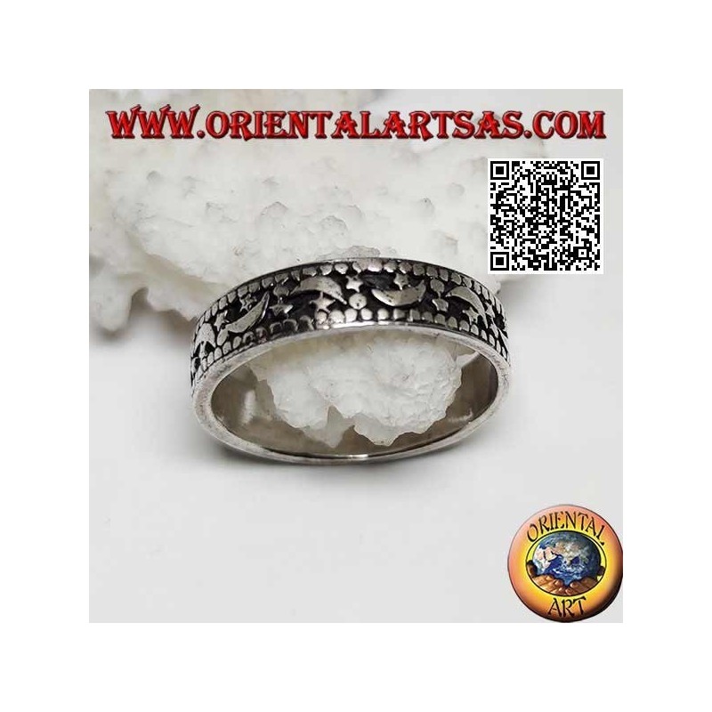 Silver ring with moons and stars on a hollowed background
