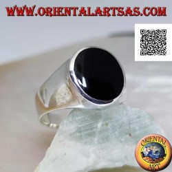 Silver ring with oval onyx flush with slightly raised edge on smooth frame