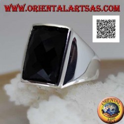 Silver ring with slightly raised rectangular curved faceted onyx on smooth setting
