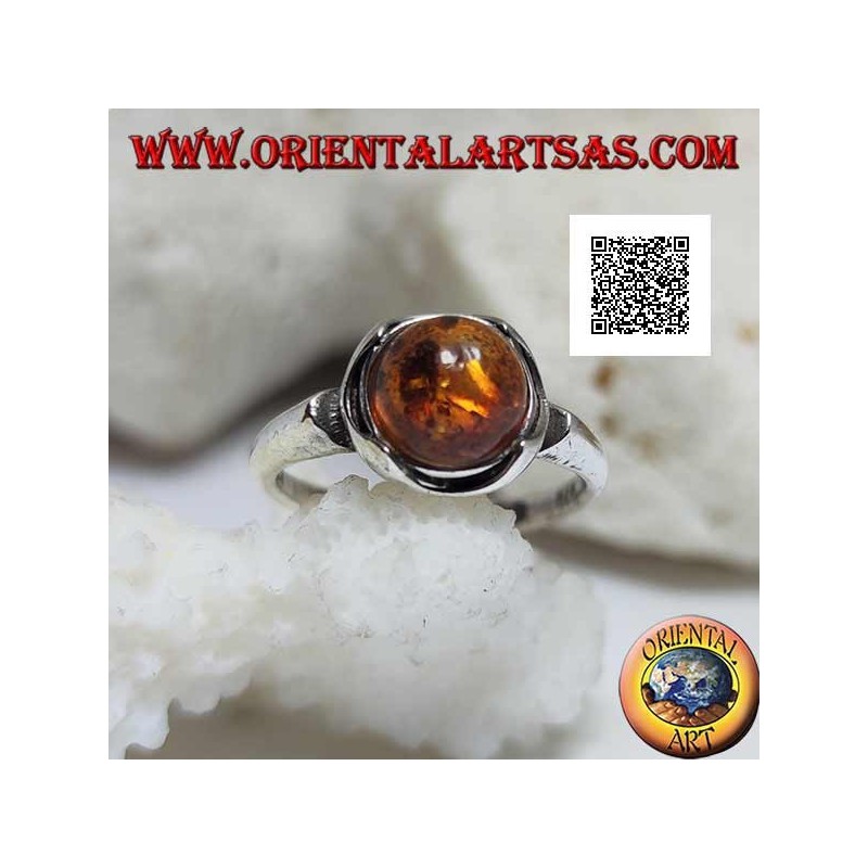 Silver ring with round cabochon amber surrounded by semicircles on a smooth setting