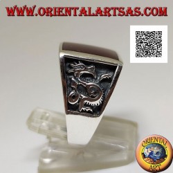 Silver ring with square carnelian and profile dragon in bas-relief on the sides