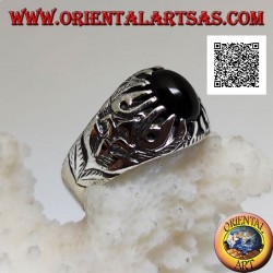 Silver ring with oval cabochon onyx set with claws and embossed floral decorations on the sides