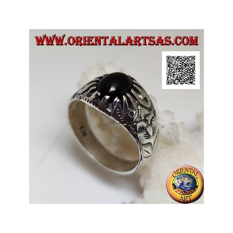 Silver ring with oval cabochon onyx set with claws and embossed floral decorations on the sides