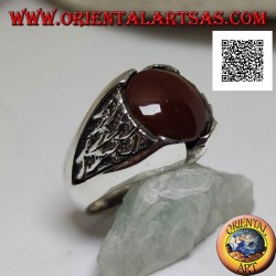 Silver ring with round carnelian and motif in the triangle in bas-relief on the sides