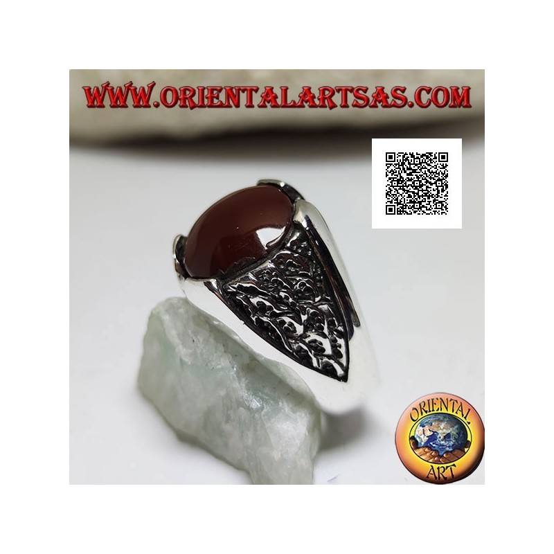 Silver ring with round carnelian and motif in the triangle in bas-relief on the sides