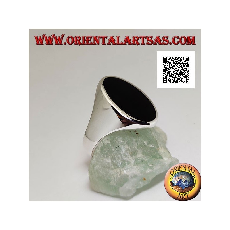 Silver ring with oval onyx elongated flush with the edge on a smooth frame