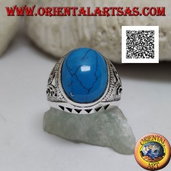 Silver ring with oval cabochon turquoise and floral and triangular decoration on the sides