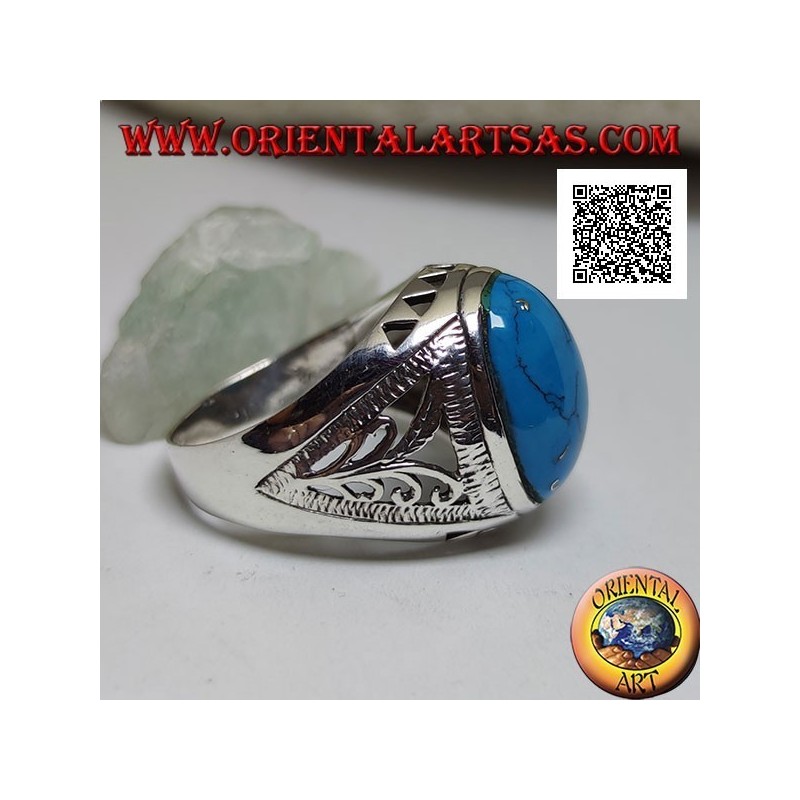 Silver ring with oval cabochon turquoise and floral and triangular decoration on the sides