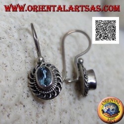 Silver earrings with faceted oval blue topaz surrounded by interweaving and bas-relief quotation marks