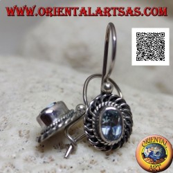 Silver earrings with faceted oval blue topaz surrounded by interweaving and bas-relief quotation marks