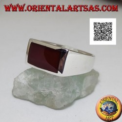 Silver ring with horizontal rectangular carnelian flush with the edge on a smooth setting