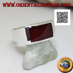 Silver ring with horizontal rectangular carnelian flush with the edge on a smooth setting